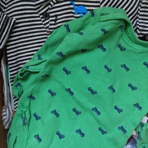 Box of assorted baby clothes